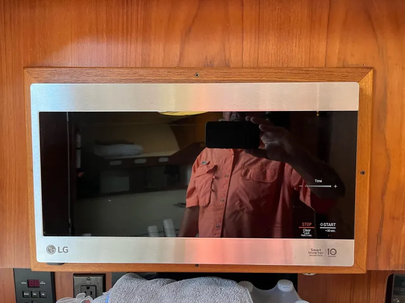 Slide: The Image of LG microwave in a 1998 Luhrs 40 Open boat interior. - 15