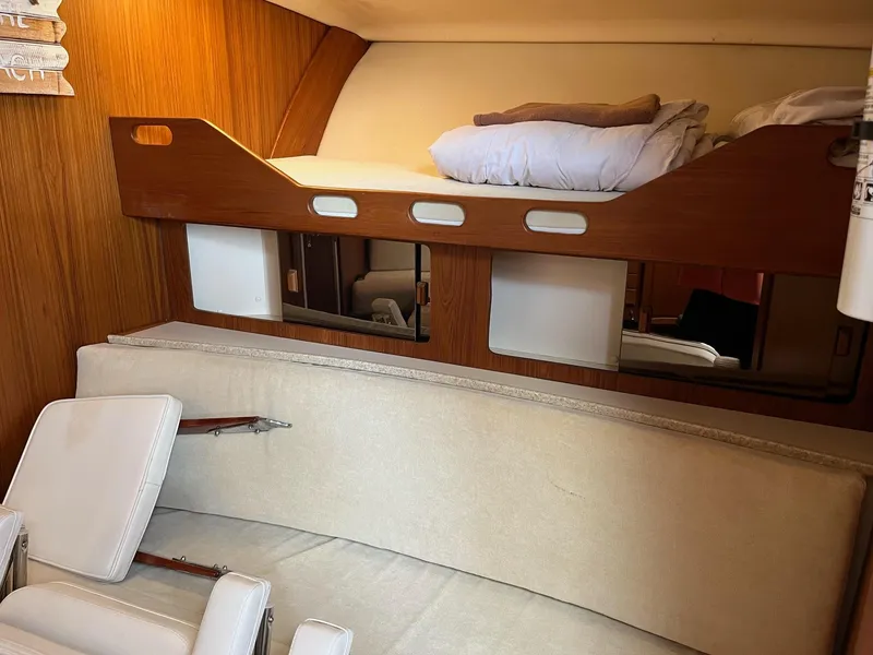 Slide: The Image of 1998 Luhrs 40 Open cabin interior with bunk bed and seating area. - 16