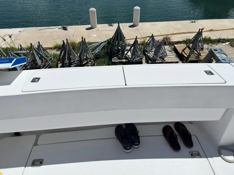 Slide: The Image of 1998 Luhrs 40 Open boat deck with shoes, dockside view. - 3