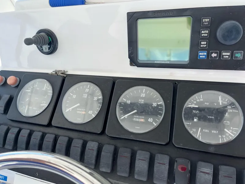 Slide: The Image of Instrument panel of 1998 Luhrs 40 Open boat with gauges and controls. - 5