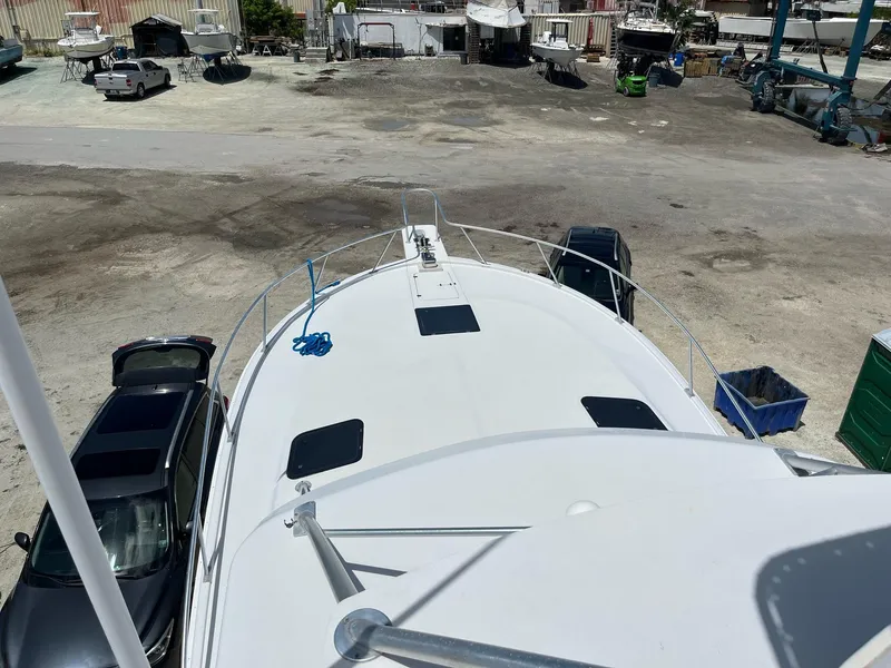 Slide: The Image of Aerial view of 1998 Luhrs 40 Open boat on dry dock, surrounded by vehicles. - 6