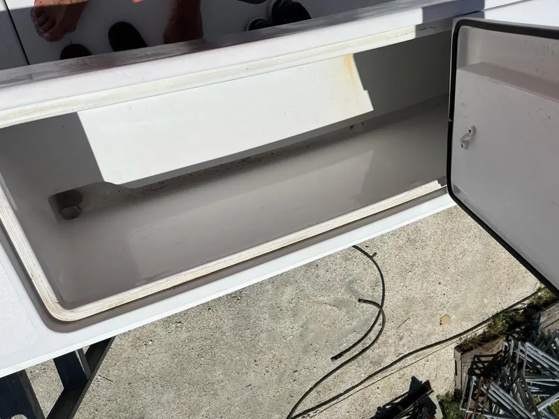 Slide: The Image of Open storage compartment on 1998 Luhrs 40 Open boat. - 9