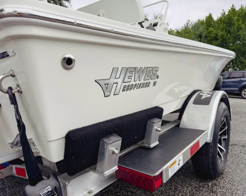 Slide: The Image of 2025 Hewes 16 Redfisher boat on trailer, side view. - 5