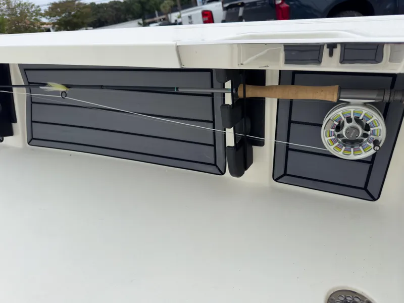 Slide: The Image of 2025 Hewes 16 Redfisher boat with fishing rod holder and reel. - 7