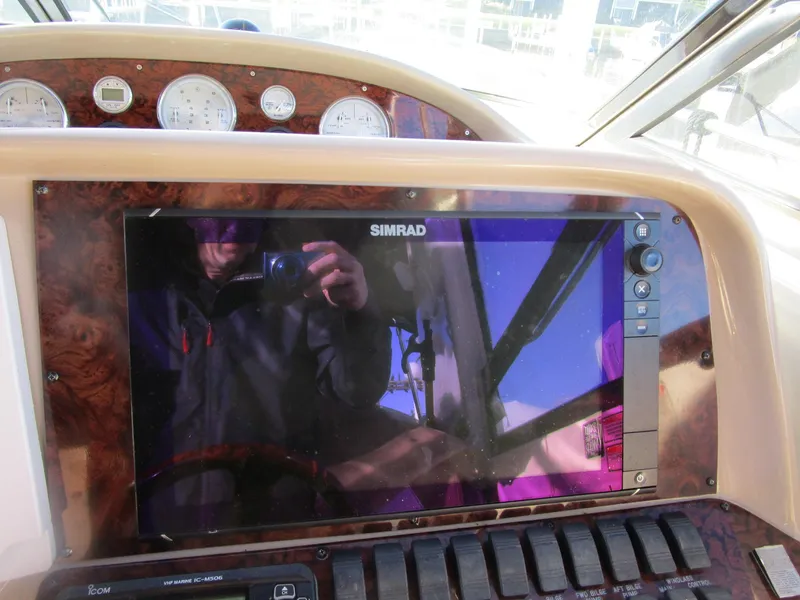 Slide: The Image of Dashboard of 2001 Sea Ray 340 Amberjack with Simrad display and gauges. - 13