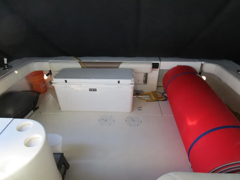 Slide: The Image of 2001 Sea Ray 340 Amberjack boat deck with cooler and red buoy. - 14