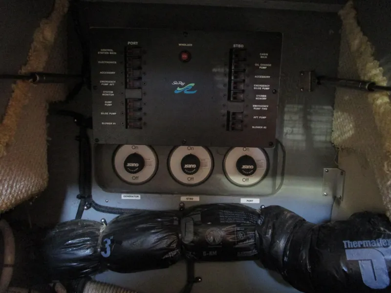Slide: The Image of Electrical panel of 2001 Sea Ray 340 Amberjack boat, featuring switches and wiring. - 22