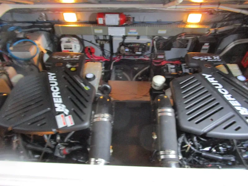 Slide: The Image of Engine room of 2001 Sea Ray 340 Amberjack with twin Mercury engines. - 26