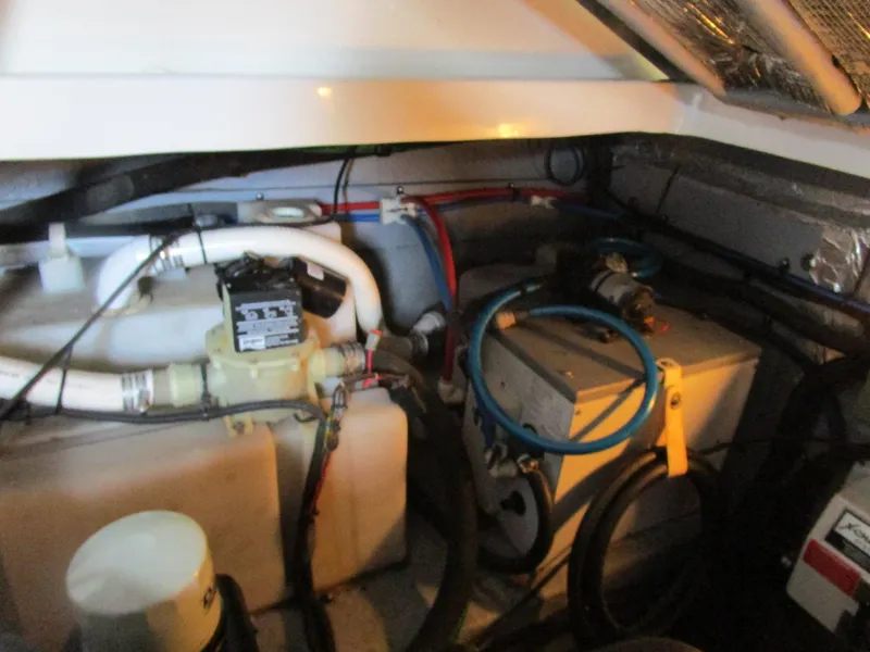 Slide: The Image of Engine compartment of 2001 Sea Ray 340 Amberjack with visible mechanical components. - 29