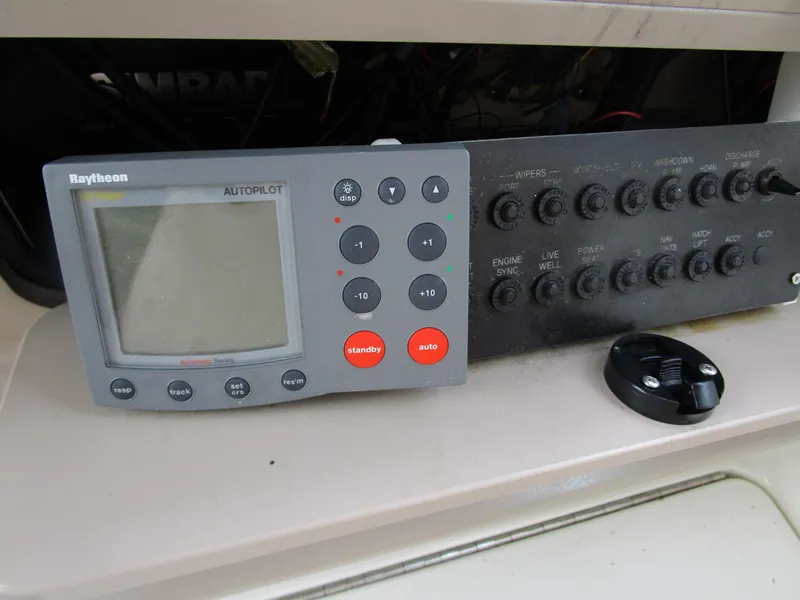 Slide: The Image of Raytheon autopilot system on 2001 Sea Ray 340 Amberjack boat dashboard. - 30