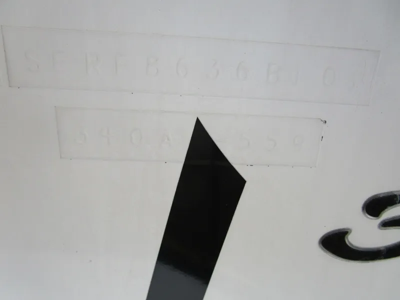 Slide: The Image of Close-up of 2001 Sea Ray 340 Amberjack hull identification number. - 32