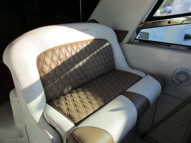 Slide: The Image of 2001 Sea Ray 340 Amberjack interior with brown and white quilted seating. - 6