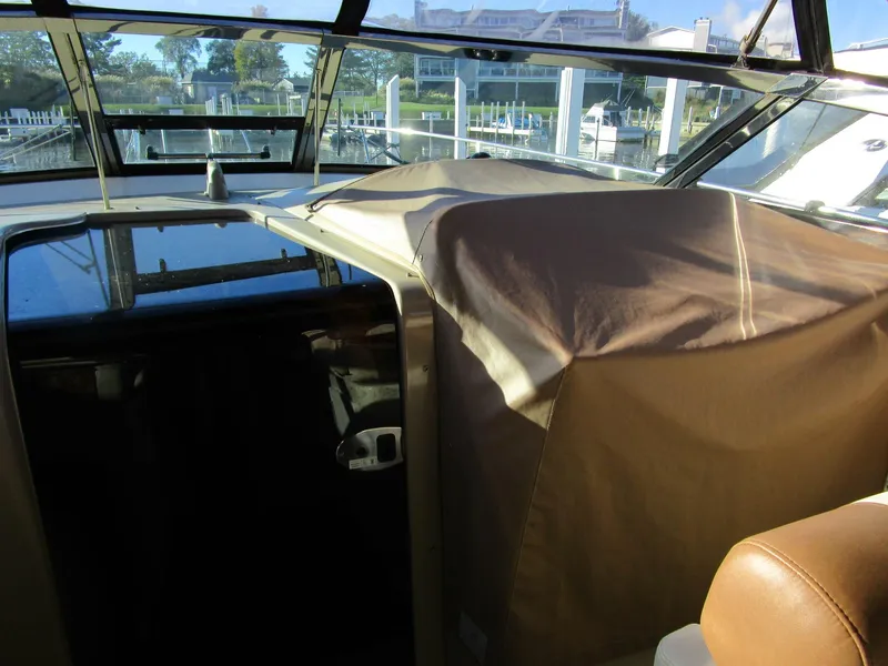 Slide: The Image of Interior view of a 2001 Sea Ray 340 Amberjack boat with covered seating area. - 9