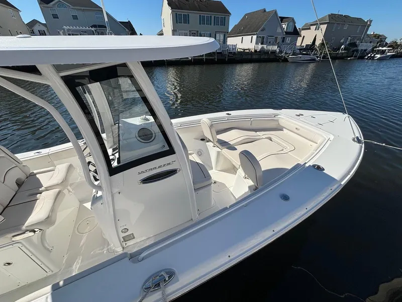 Slide: The Image of 2020 Sea Hunt Ultra 275 SE boat docked in a residential marina. - 4