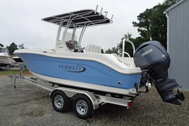Slide: The Image of 2025 Robalo R200 Center Console boat on trailer with Yamaha engine. - 19