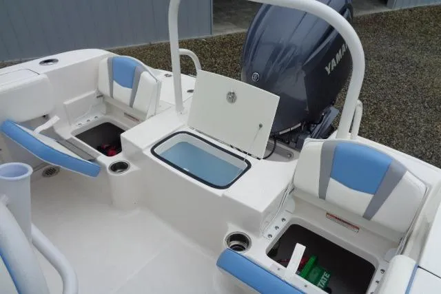 Slide: The Image of 2025 Robalo R200 Center Console boat interior with Yamaha engine, featuring seating and storage compartments. - 20