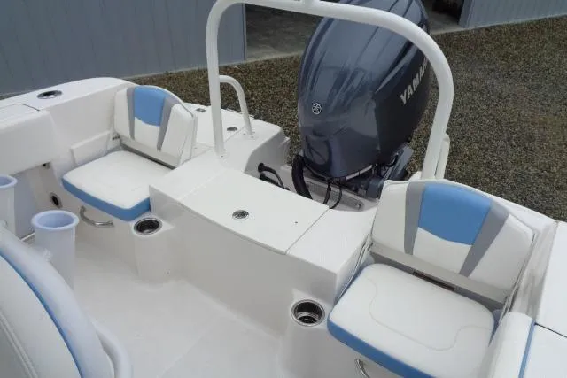 Slide: The Image of 2025 Robalo R200 Center Console boat interior with seating and Yamaha outboard motor. - 21