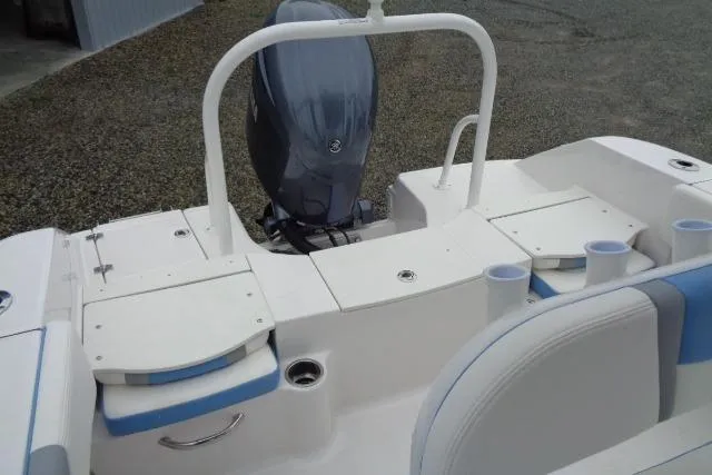 Slide: The Image of 2025 Robalo R200 Center Console boat with sleek seating and powerful outboard motor. - 22