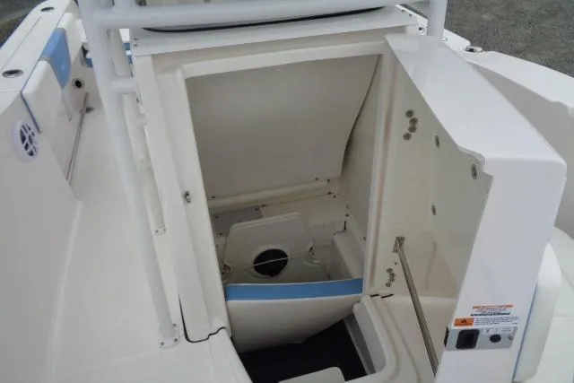 Slide: The Image of 2025 Robalo R200 Center Console boat storage compartment, open and empty. - 25