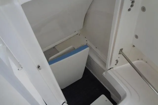 Slide: The Image of 2025 Robalo R200 Center Console interior storage compartment detail. - 26