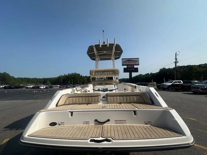 Slide: The Image of 2022 Yamaha Boats 210 FSH® SPORT, rear view, parked outdoors, clear sky. - 3