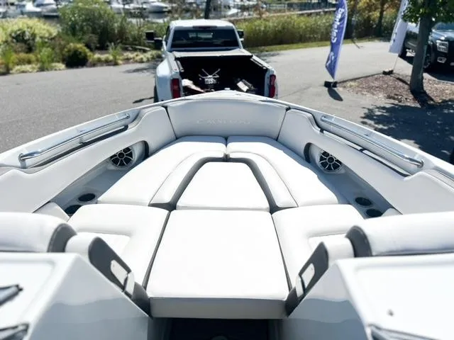 Slide: The Image of 2025 Crownline 290 XSS boat interior with plush seating and modern design. - 11