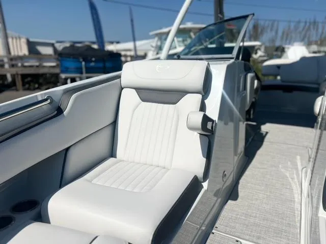 Slide: The Image of 2025 Crownline 290 XSS boat interior with luxurious white seating and modern design. - 18