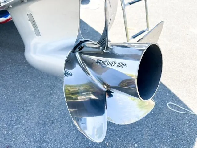 Slide: The Image of 2025 Crownline 290 XSS boat with Mercury 22P propeller, close-up view. - 8