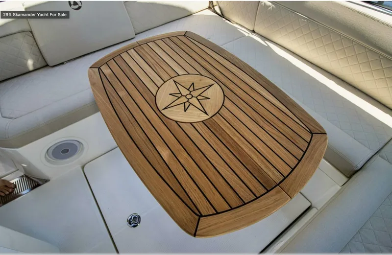 Slide: The Image of Luxurious 2024 Skamander 850 Voyager yacht interior with elegant wooden table design. - 28