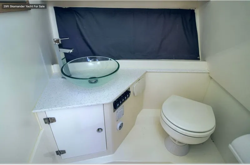 Slide: The Image of Modern bathroom in 2024 Skamander 850 Voyager yacht with glass sink and toilet. - 31