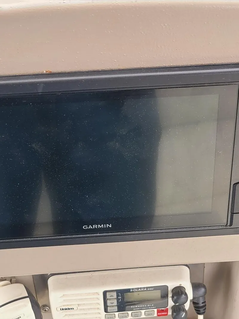 Slide: The Image of Garmin navigation display on 2004 Cruisers 3372 boat dashboard. - 27