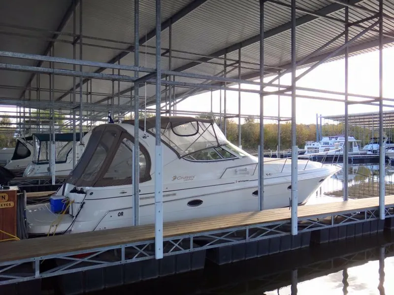 Slide: The Image of 2004 Cruisers 3372 yacht docked in a covered marina. - 4