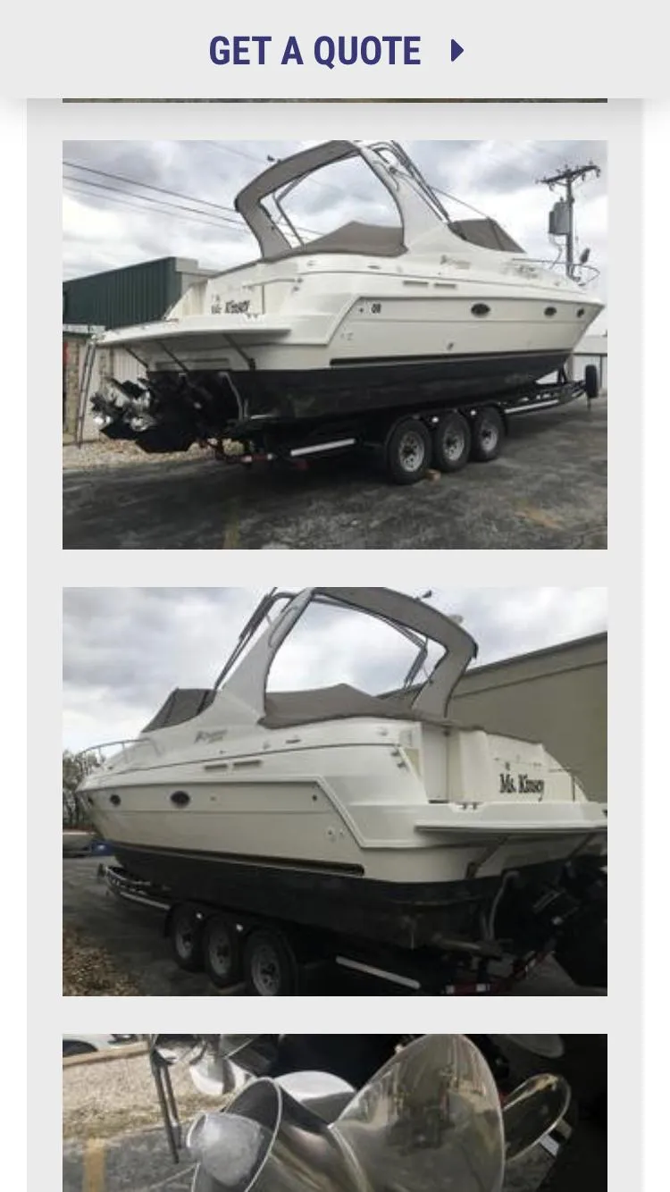 Slide: The Image of 2004 Cruisers 3372 boat on trailer, side and rear views, ready for transport. - 8