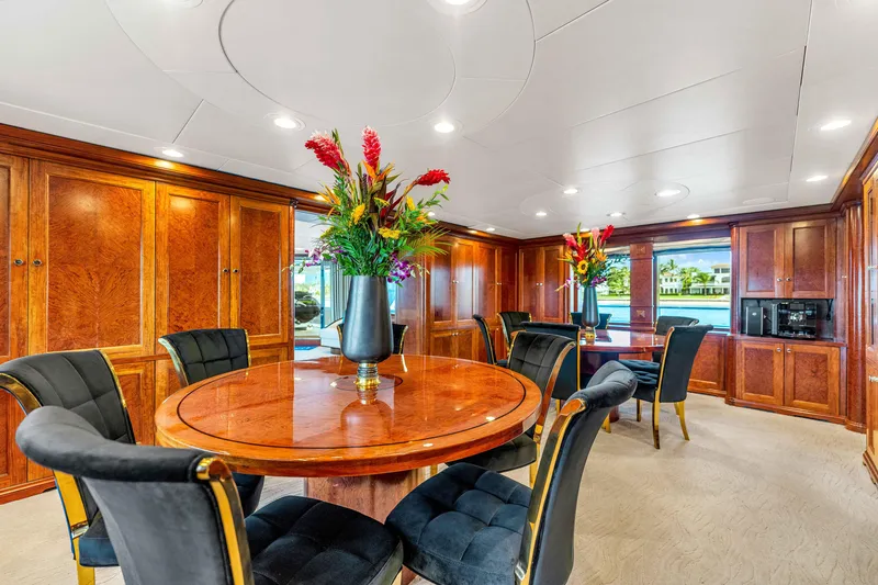 Slide: The Image of Luxurious 1998 Admiral Pilothouse yacht interior with elegant seating, vibrant artwork, and wooden accents. - 12