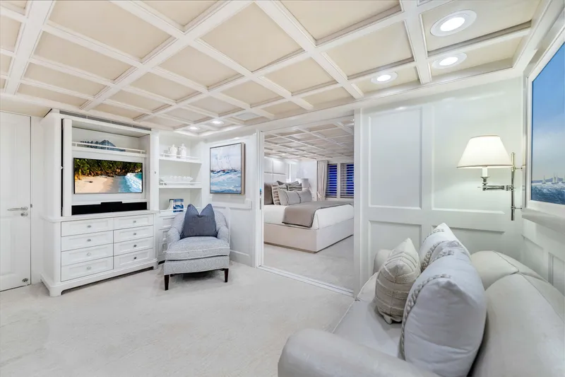 Slide: The Image of Luxurious 1998 Admiral Pilothouse interior with elegant seating, artwork, and coffered ceiling. - 17