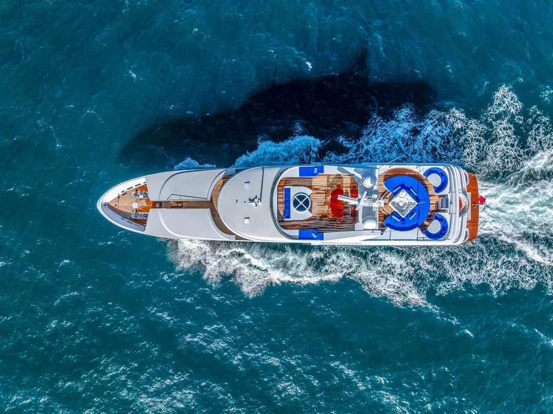 Slide: The Image of Luxurious 1998 Admiral Pilothouse yacht cruising on open sea under clear blue sky. - 2