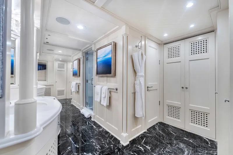 Slide: The Image of Luxurious Admiral Pilothouse 1998 interior with elegant white decor and built-in shelving. - 23