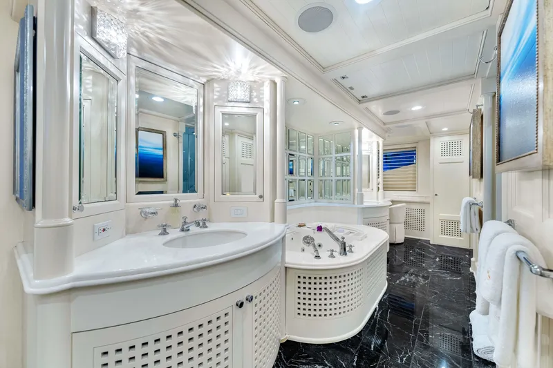 Slide: The Image of Luxurious Admiral Pilothouse 1998 yacht bathroom with marble floor, elegant fixtures, and modern decor. - 24