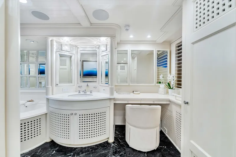 Slide: The Image of Luxurious yacht bathroom with elegant fixtures, marble floor, and modern design, Admiral Pilothouse 1998. - 28