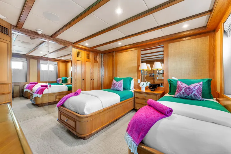 Slide: The Image of Luxurious wooden interior of 1998 Admiral Pilothouse yacht with spiral staircase and bedroom view. - 31
