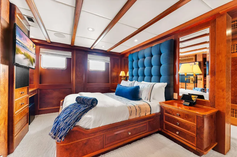 Slide: The Image of Luxurious bathroom in 1998 Admiral Pilothouse yacht with marble finishes and wooden accents. - 33
