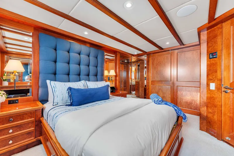 Slide: The Image of Luxurious 1998 Admiral Pilothouse interior with wood paneling, TV, vanity, and plant. - 35
