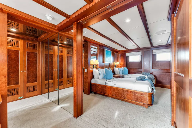 Slide: The Image of Luxurious wooden interior of 1998 Admiral Pilothouse yacht with elegant cabinetry and mirrored accents. - 38