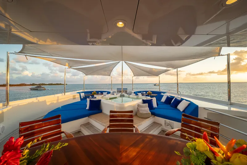 Slide: The Image of Luxurious Admiral Pilothouse yacht deck with bar, seating, and ocean view, 1998 model. - 7