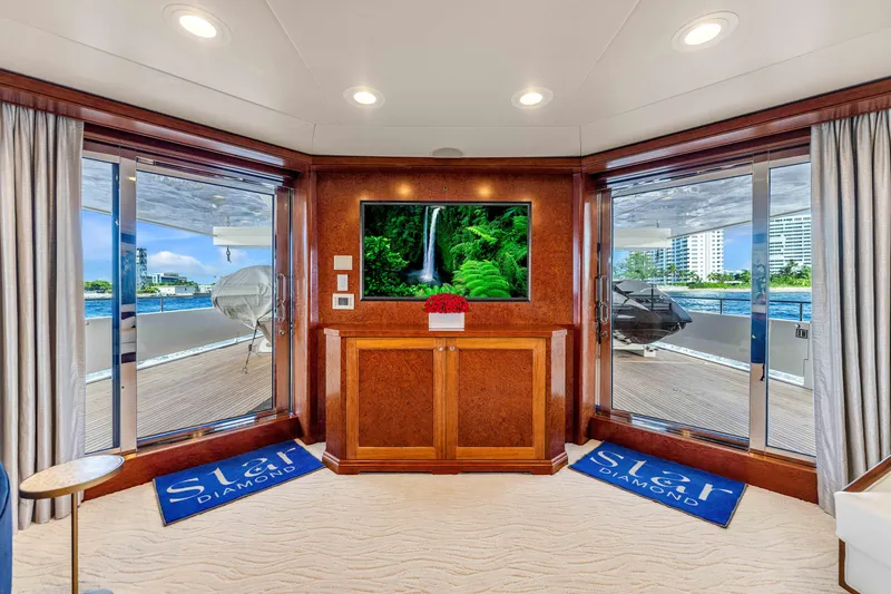 Slide: The Image of Luxury yacht deck with sun loungers, overlooking turquoise ocean. Admiral Pilothouse, 1998 model. - 9