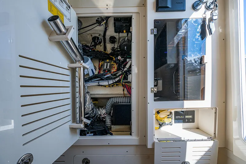 Slide: The Image of 2023 Scout LXF boat interior wiring and control panel. - 15