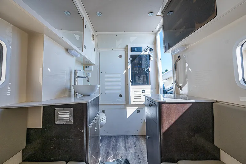 Slide: The Image of Interior of 2023 Scout LXF camper, featuring modern design and compact amenities. - 17