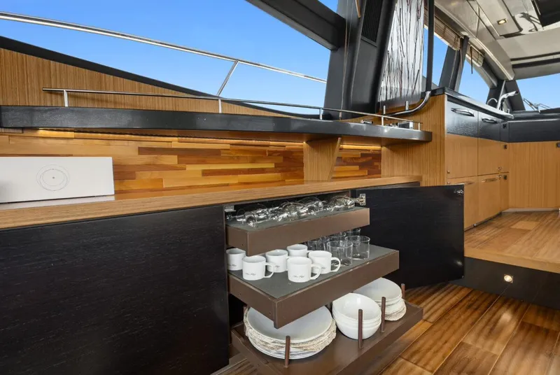 Slide: The Image of Luxurious interior of 2017 Sea Ray L590 Sport yacht with elegant wooden cabinetry. - 10