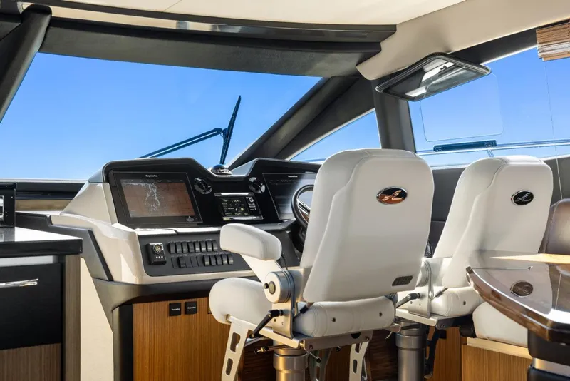 Slide: The Image of Interior cockpit of 2017 Sea Ray L590 Sport yacht with modern controls. - 15