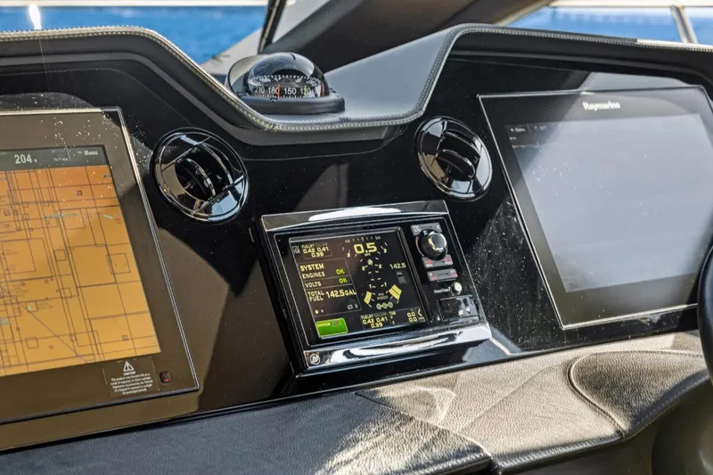 Slide: The Image of 2017 Sea Ray L590 Sport yacht dashboard with navigation and control screens. - 19